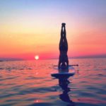 sup yoga headstand sunset