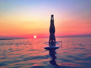sup yoga headstand sunset