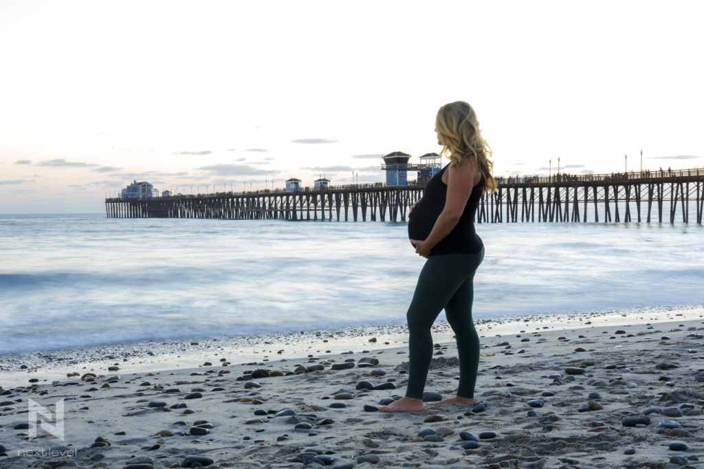 pregnant woman on beach oceanside