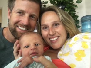 newborn with family