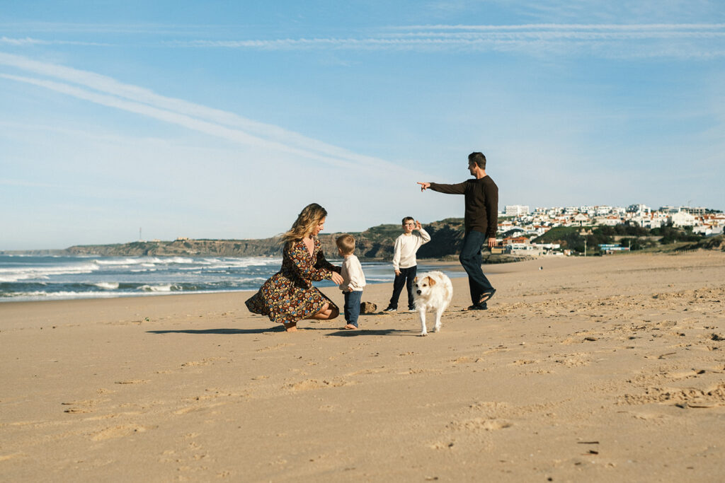 Travis Family playing on the beach in Portugal.